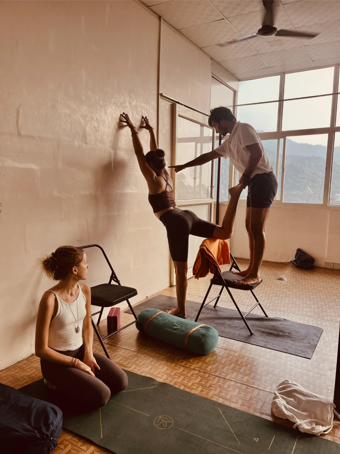Assisted advanced practice with props at Prakruti Yogashala